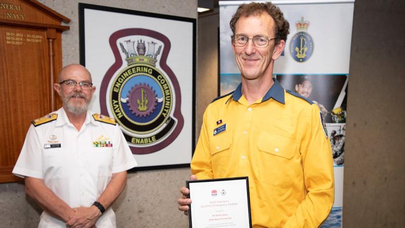 Head of Navy Engineering Branch Commodore Colin Dagg with engineer Simon Sykes who received a NSW Premier’s Bushfire Emergency Citation. Photo: Petty Office Bradley Darvill