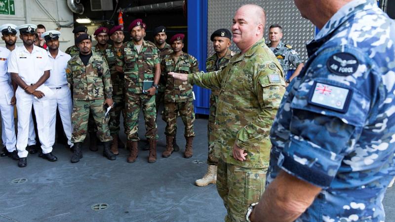 Major General Roger Noble welcomes members of the Sri Lankan Navy aboard HMAS Canberra at Colombo, Sri Lanka, during Indo-Pacific Endeavour 2019. Photo: Leading Seaman Steven Thomson