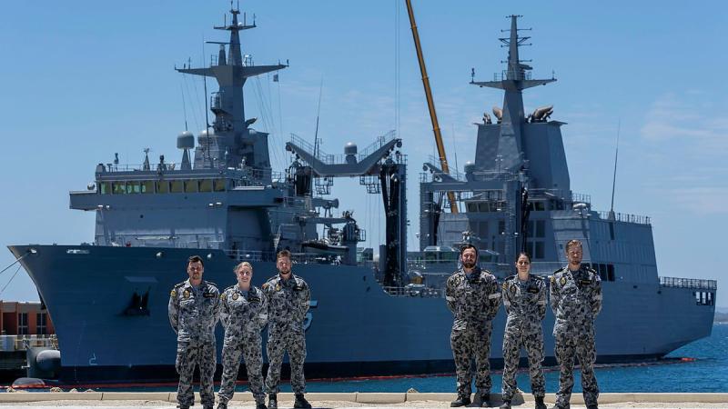 Marine technicians Able Seamen Greg Hallet, left, Cassandra Bullock, Mason Turner, Cody Martin, Yassi Coban and Leading Seaman Morse Stanton in front of NUSHIP Supply at Fleet Base West, Western Australia. Photo: Leading Seaman Ronnie Baltoft