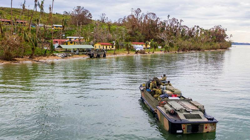 Soldiers from the 10th Force Support Battalion drive a light amphibious resupply cargo 5 onto the island of Galoa, in Fiji to drop off supplies required to repair buildings affected by Cyclone Yasa. Photo: Corporal Dustin Anderson