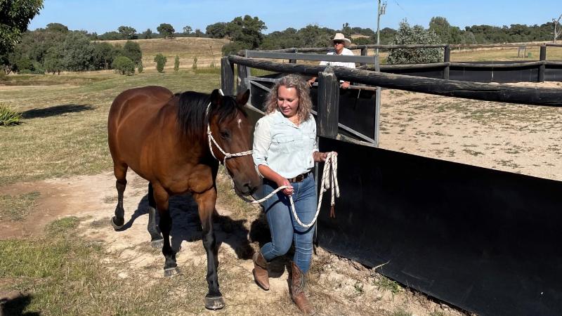 Leading Seaman Amanda Petersen walks with Boss during a planning day for the Navy recruiting team.