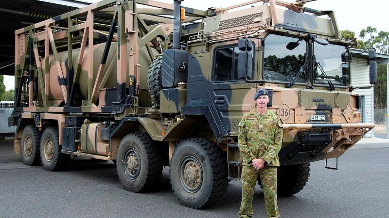 Warrant Officer Class 2 Lance Keighran in front of a MAN HX77 truck at the Army School of Transport in Puckapunyal, Victoria. Photo: Corporal William Spence