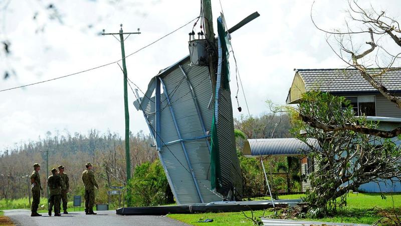 Army personnel inspect the damage caused by Tropical Cyclone Yasi at Cowley Beach in February, 2011.
