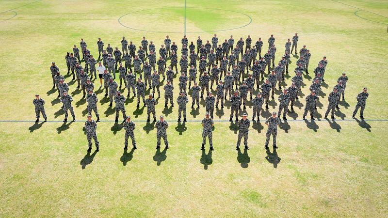 NUSHIP Stalwart's crew form for the first time on the sports field of HMAS Stirling, Western Australia. Photo: Leading Seaman Richard Cordell 