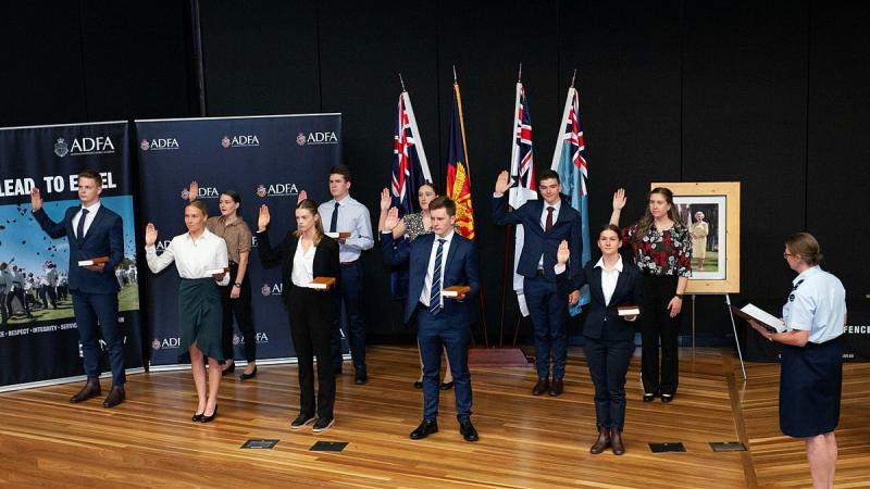 Air Commodore Wendy Blyth administers the oath to 10 new members of the RAAF at an appointment ceremony at the Australian Defence Force Academy in Canberra. Photo: John Carroll