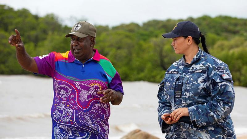 Indigenous Liaison Officer Flight Lieutenant Kristal House engages with Deputy Chair of the Kauareg Native Title Elizah Wasaga on the King's Point beach at Ngurupai (Horn Island) in the Torres Strait. Photo: Corporal Jesse Kane