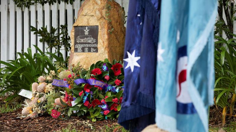 Wreaths surround the memorial plaque at the rededication service commemorating the 80th anniversary of the RAAF Anson A4-5 crash at Glenbrook, NSW. Photo: Corporal Kylie Gibson