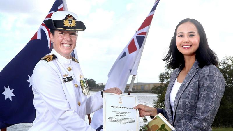 Commanding Officer HMAS Moreton Commander Phillipa Hay appoints Roslyn Gibson to the Royal Australian Navy during a ceremony in Brisbane. 