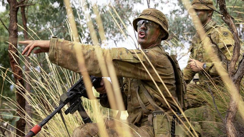 Army Officer Cadet Lachlan Goodall gives orders during a section attack at the Majura Training Area. Photo: Corporal Robert Whitmore