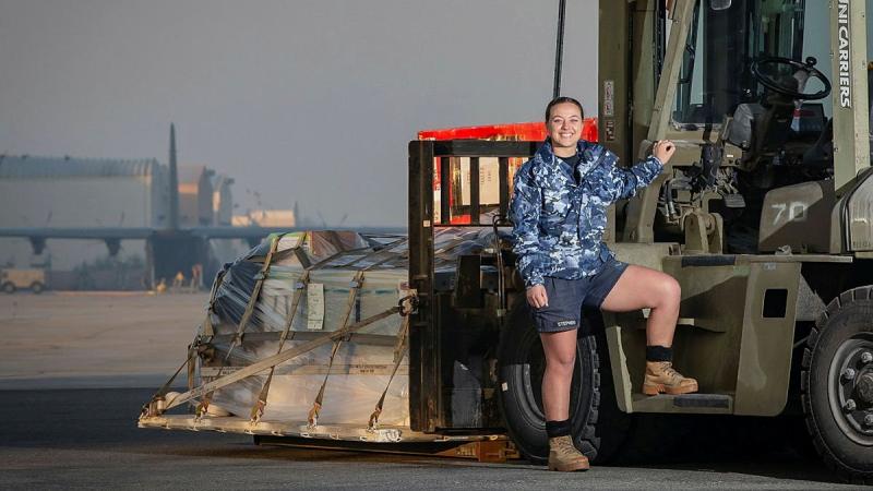 Leading Aircraftwoman Lisa Stephens prepares to load a C-130J Hercules in the Middle East region. Photo: Sergeant Ben Dempster