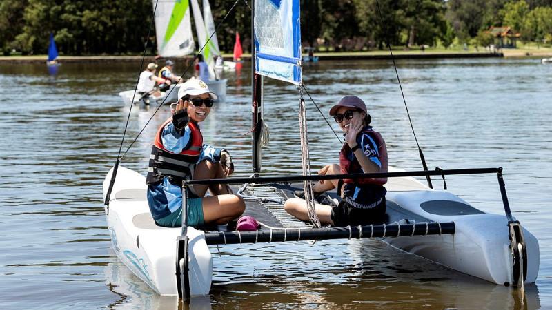 Aircraftwoman Ayumi Kono, left, and Aircraftwoman Samantha Shen enjoy a morning of sailing at Lake Burley Griffin, Canberra. Photo: Sergeant Janine Fabre 