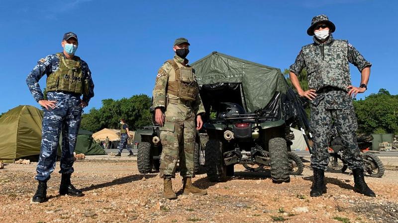 Wing Commander Stuart Wheal, left, United States Air Force Commander Lieutenant Colonel Christopher Denzer and Japan Air Self-Defense Force Commander Major Kenji Hoka during Exercise Cope North 21. Photo: Squadron Leader David Weekley