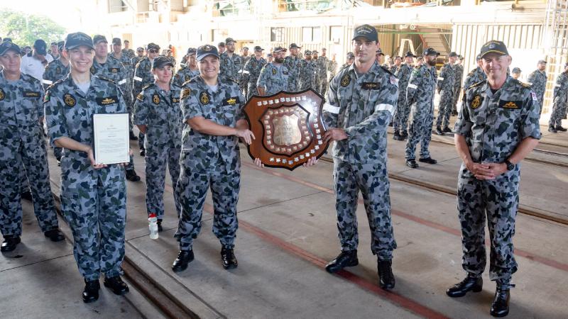 Commander of the Australian Fleet Rear Admiral Mark Hammond, right, presents the Kelly Shield to HMAS Childers at HMAS Coonawarra, Darwin, Northern Territory.