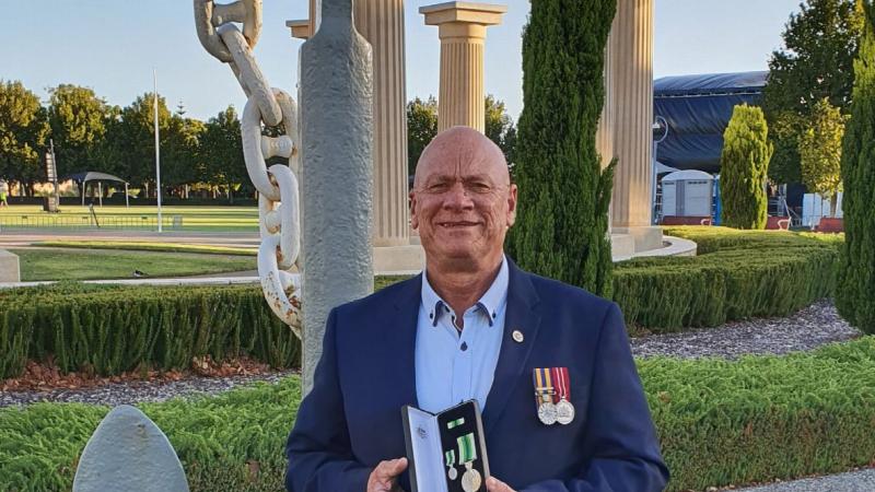 Former Chief Petty Officer Danny Joyce is awarded the Australian Service Medal at Anzac Park in Rockingham, Western Australia.