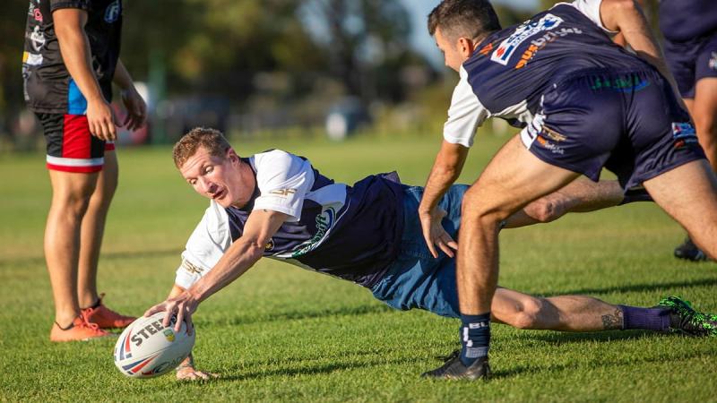 Petty Officer Stephen Swanson participates in a training session with the Navy Tridents rugby league team at the Lark Hill Sporting Complex in Port Kennedy, WA. Photo: Leading Seaman Ernesto Sanchez 