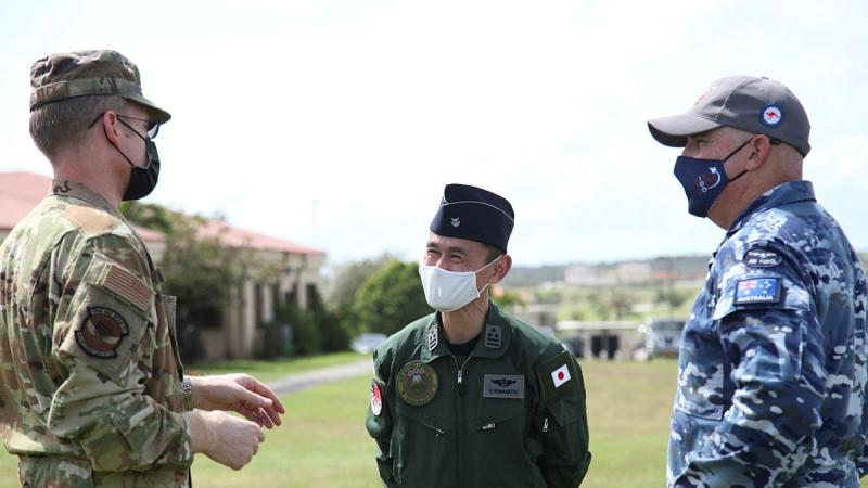 Lieutenant Colonel Adam Shockley from the US Air Force, Colonel Shinobu Yamamoto from the Japanese Air Self-Defense Force and Wing Commander Alan Brown from RAAF discuss operational matters during Exercise Cope North. Photo: Master Sergeant Masumi Suehara