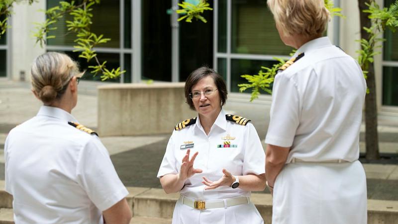 Director of Gender, Peace and Security Captain Jenn Macklin, then commander, chats with Defence members in Canberra last year, at an event marking the 20th anniversary of the UN Security Council Resolution 1325. Photo: Kym Smith 