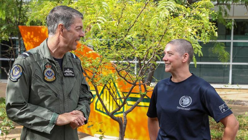 Senior Australian Defence Force Officer - Edinburgh precinct Air Commodore Ross Bender with Flight Lieutenant Lauren Hartley after she had her head shaved to raise money for the Lung Foundation Australia. Photo: Corporal Brenton Kwaterski