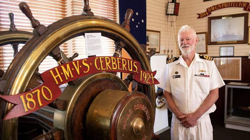 HMAS Cerberus Museum Manager Commander John Goss with historic items from HMVS Cerberus in the HMAS Cerberus Museum in Westernport, Victoria. Photo: Leading Seaman Bonny Gassner