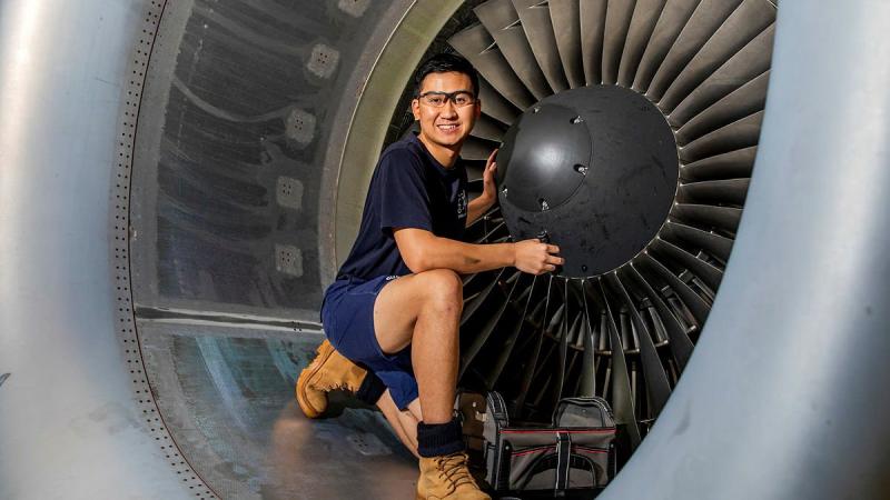 Leading Aircraftman Trung Phan, an aircraft structural fitter from No 36 Squadron, performs maintenance on a C-17 Globemaster III engine at RAAF Base Amberley. Photo: Leading Aircraftwoman Emma Schwenke