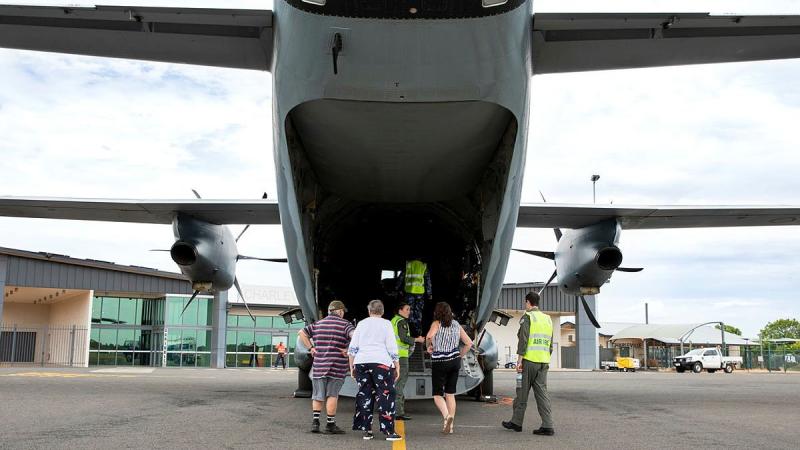 Flight Lieutenant Matthew Still, right, and Loadmaster Corporal Joanna Fletcher give residents a tour of a C-27J Spartan at Charleville Airport, Queensland. Photo: Leading Aircraftwoman Emma Schwenke 