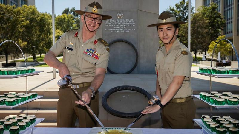 Chief of Army Lieutenant General Rick Burr, left, and Private Harrison Nguyen cut the cake during Army’s 120th birthday celebrations in Canberra. Photo: Sagi Biderman