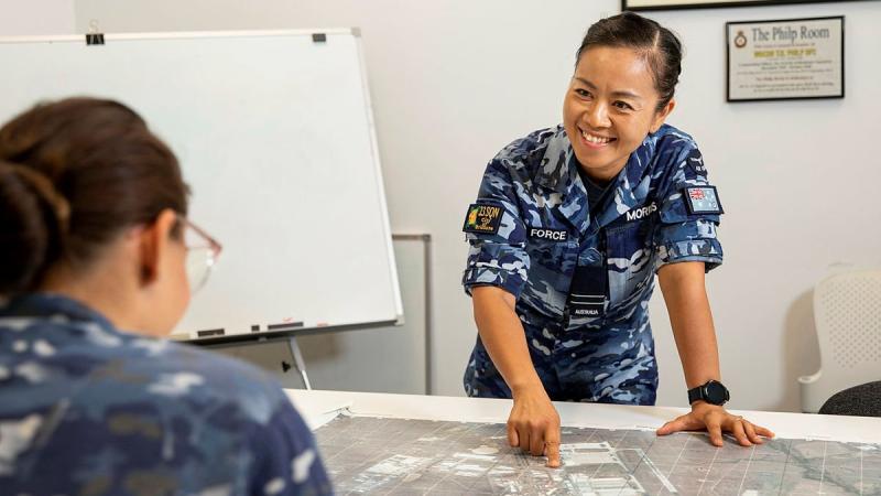 Flight Lieutenant Rachel Morris from No. 23 Squadron briefs her team on events around RAAF Base Amberley. Photo: Leading Aircraftwoman Emma Schwenke 