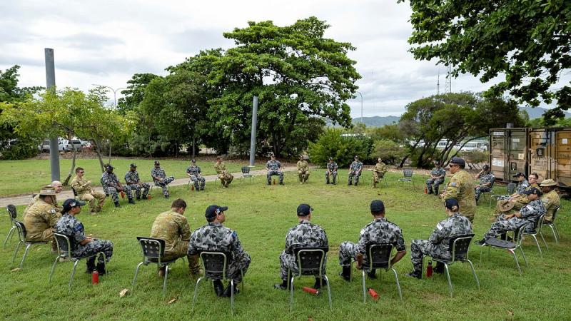 Navy Indigenous Development Program recruits take part in a yarning circle with soldiers from the 10th Force Support Battalion during a visit to Ross Island Barracks in Queensland. Photo: Corporal Brodie Cross