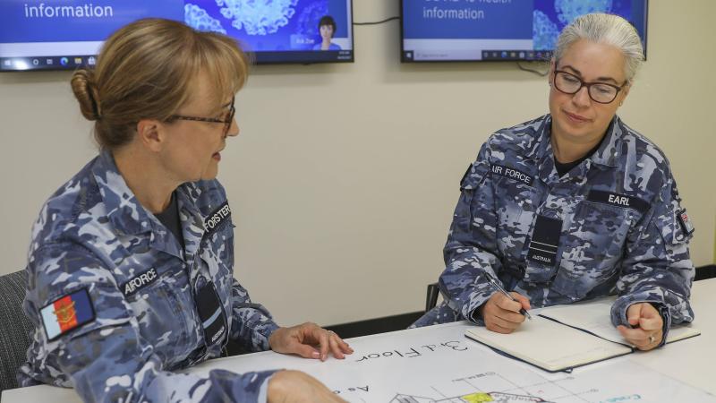 Air Commodore Margot Forster, left, with her sister Flight Lieutenant Melody Earl, at RAAF Base Edinburgh, South Australia, in the lead up to International Women's Day. Photo, Corporal Brenton Kwaterski