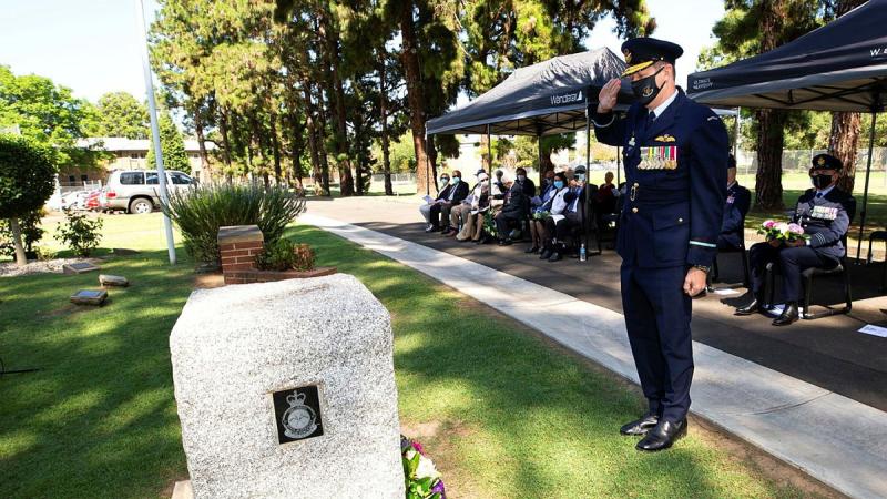 Commander Air Mobility Group Air Commodore Carl Newman salutes after laying a wreath during the Battle of the Bismarck Sea commemorative service at RAAF Base Richmond. Photo: Corporal David Said
