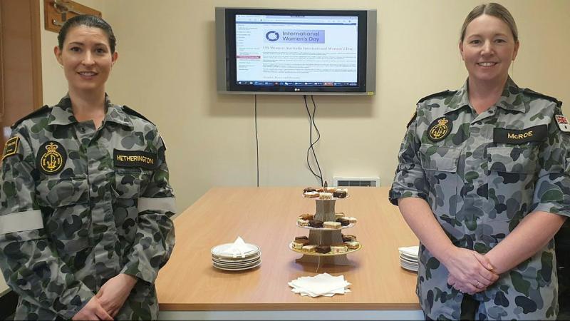 Warrant Officer Natasha McRoe, left, and Able Seaman Emily Hetherington celebrate International Women's Day on March 5 at Navy Headquarters Tasmania.