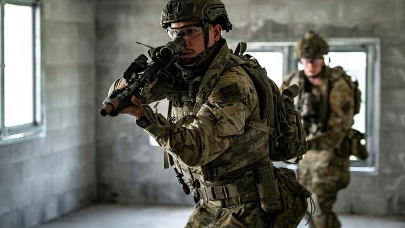 Private Keegan Newbery, front, from the 8th/9th Battalion, Royal Australian Regiment, conducts a room clearance during urban warfare tactical assault training at Gallipoli Barracks. Photo: Private Jacob Hilton