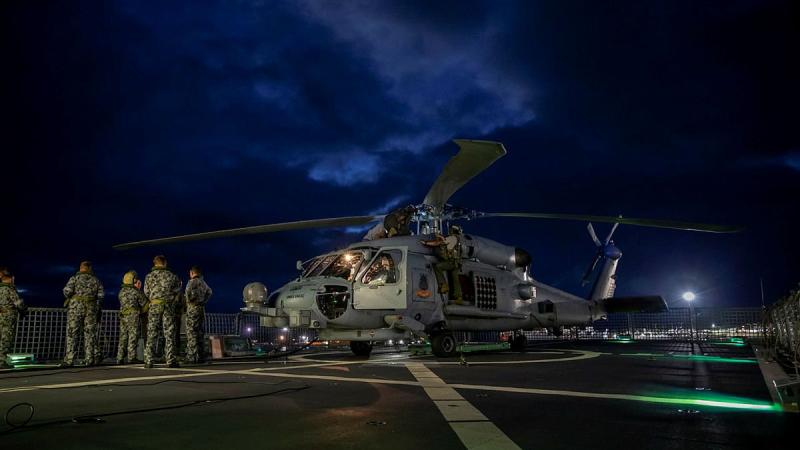The MH-60R helicopter with the call sign Berserker being prepared for launch from HMAS Anzac. Photo: Leading Seaman Thomas Sawtell