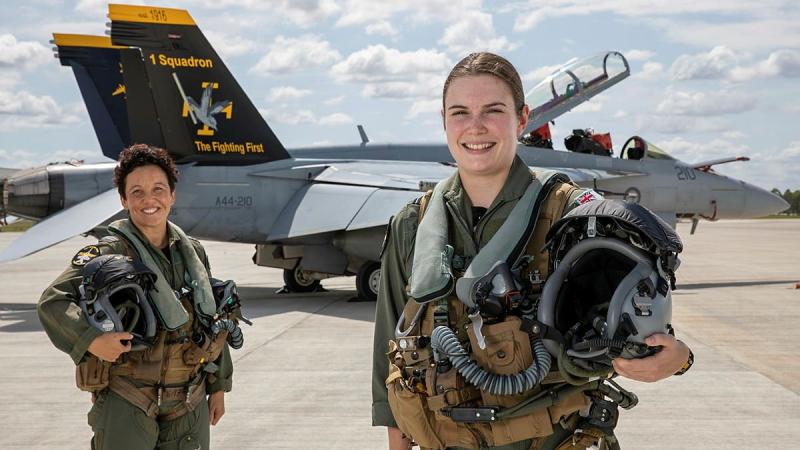 Air Force Super Hornet weapons system officer Flight Lieutenant Zalie, left, and pilot Flying Officer Sophie in front of a No. 1 Squadron F/A-18F Super Hornet at RAAF Base Amberley. Photo: Corporal Nicci Freeman