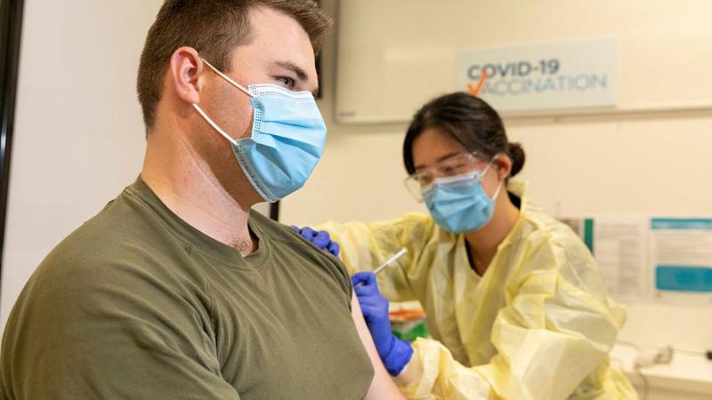 Trooper Jack Calcino receives a COVID-19 vaccine from registered nurse Daisy Hwang at the Royal Adelaide Hospital. Photo: Leading Aircraftman Stewart Gould
