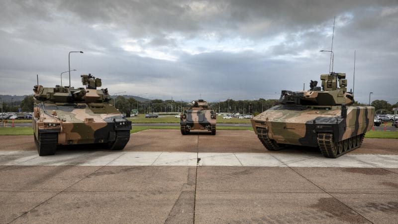  Hanwha Defense Australia Redback Infantry Fighting Vehicle, left, Australian Army Armoured Personnel Carrier M1123 AS4, and Rheinmetall Defence Australia Lynx KF41 Infantry Fighting Vehicle at Russell Offices, Canberra. Photo: Lauren Larking