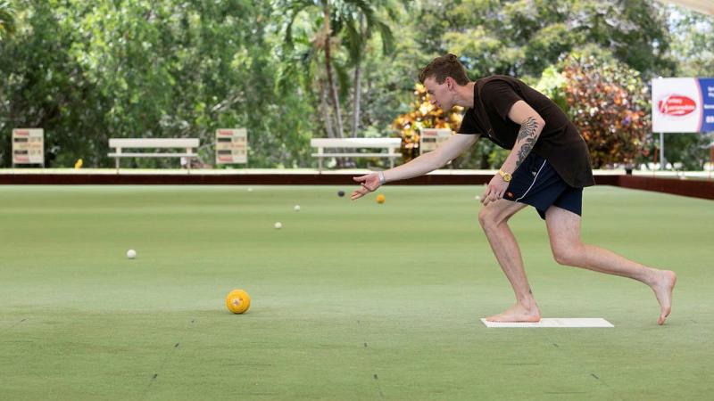 Able Seaman Lleyton Goldsmith from Fleet Logistics Support Element - Darwin bowls during the 2021 Top End Forces Shield barefoot bowls competition in Darwin. Photo: Petty Officer Peter Thompson 