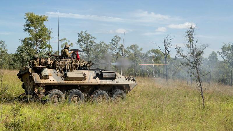 Soldiers from the 2nd Cavalry Regiment engage an enemy position with the Australian Light Armoured Vehicle’s 25mm M242 Bushmaster Chain Gun during a troop live-fire attack. Photo: Corporal Brodie Cross