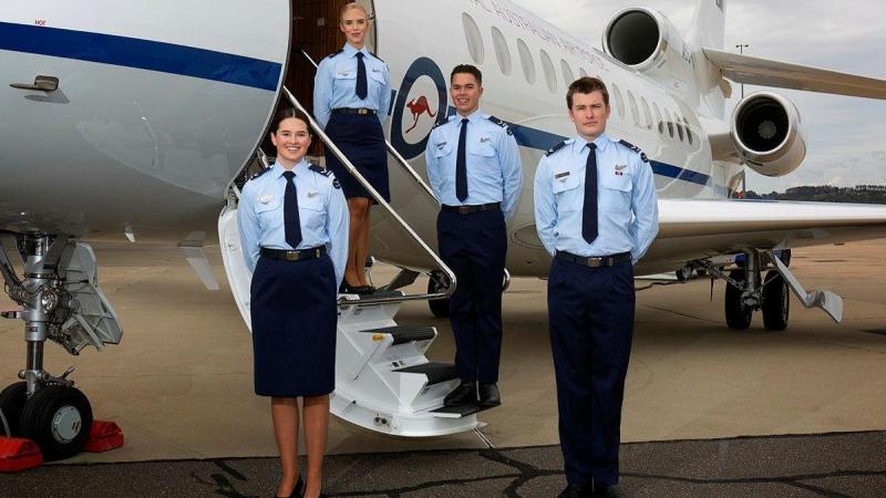 Crew attendants Leading Aircraftwoman Sophie Noonan, left, Leading Aircraftwoman Madeleine Braz, Leading Aircraftman Josh Lenard and Leading Aircraftman Jack Young on graduation day in front of the Dassault Falcon 7X. Photo: Sergeant Oliver Carter
