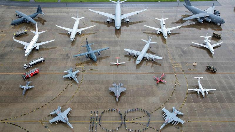 Air Force personnel representing all specialisations and musterings  form the number 100 with all in-service RAAF aircraft and ground assets at RAAF Base Amberley, Queensland. Photo: Corporal Nicci Freeman