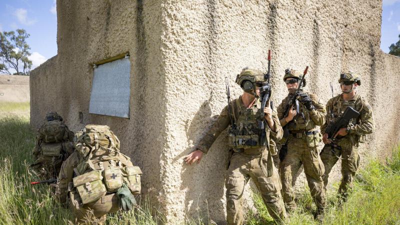 Soldiers from the 3rd Combat Engineer Regiment prepare to enter a compound during Exercise Dingo Fury at Townsville Field Training Area. Photo: Corporal Brendon Grey 