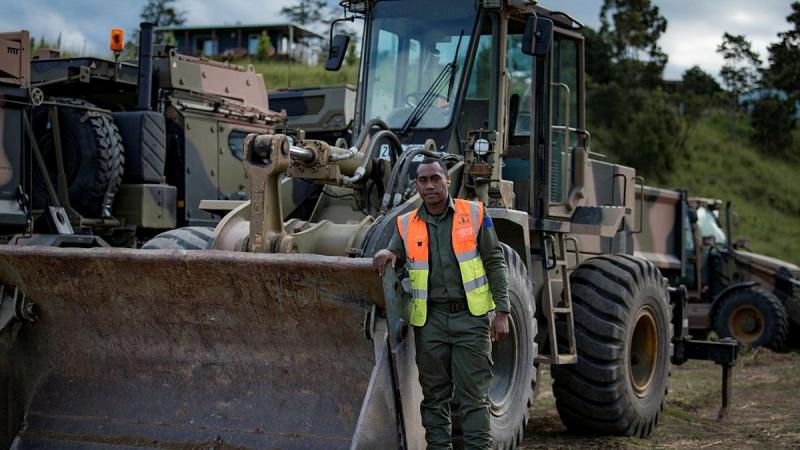 Republic of Fiji Military Forces Sapper Luke Sorovakarua with an LX 120 (front end loader) during Operation NSW Flood Assist near Wauchope, NSW. Photo: Private Jacob Hilton