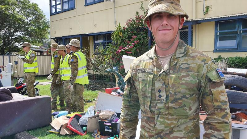 Lieutenant Kurt O’Neill, attached to the 2nd Combat Engineer Regiment, with his platoon help residents clean up after the flood at Laurieton.