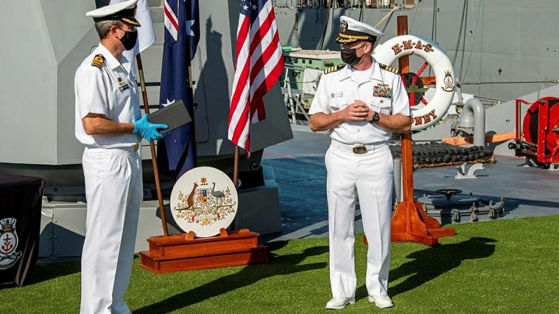Commanding Officer HMAS Sydney Commander Ted Seymour, left, presents United States Navy officer Commander Robert Eilers with a Commander Australian Fleet Silver Commendation on board Sydney in San Diego.