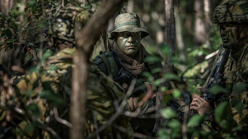 Sergeant Jone Naulivo, from the Republic of Fiji Military Forces, with soldiers from the 8th/9th Battalion, Royal Australian Regiment, during Exercise Coral Soldier. Photo: Private Jacob Hilton