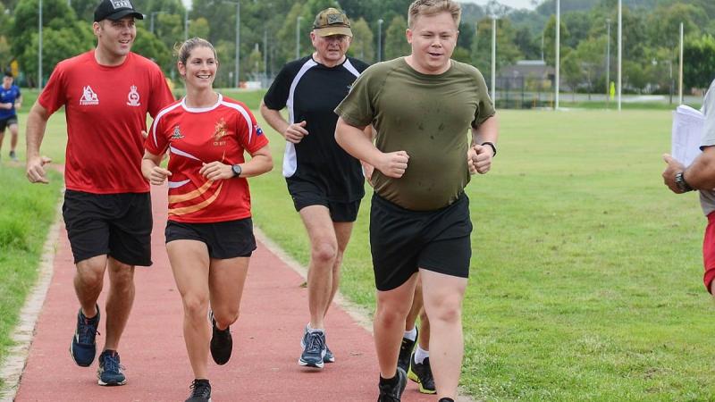 Running Change program mentors Trooper Noel Denny, Lance Bombardier Michelle Spadaro and Private Joel Bensley run around the Gallipoli Barracks running track. Photo: Corporal Kerry Uilderks