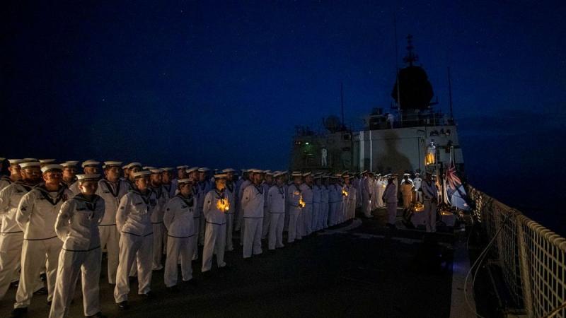 The ship's company of HMAS Anzac conducts a Dawn Service in the South China Sea. Photo: Leading Seaman Thomas Sawtell