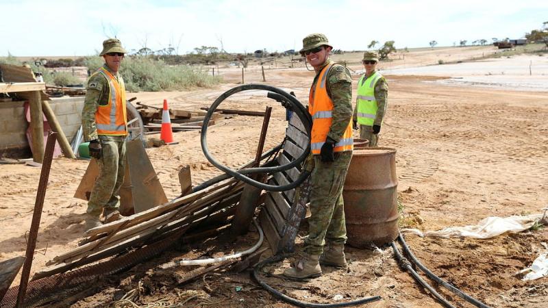 Soldiers clear debris from a Northampton farm following Tropical Cyclone Seroja.