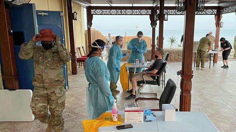 An ADF medical team from Camp Baird in the Middle East testing Multinational Force and Observers' members in the Sinai for COVID-19.