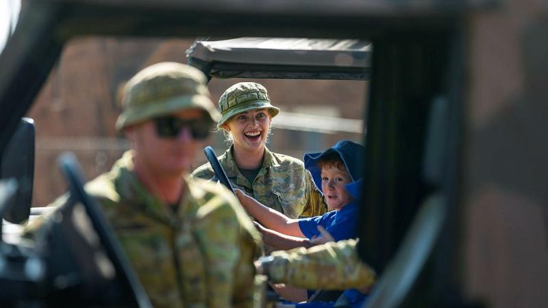 Private Matilda Tinkler shows children from St Mary's Primary School in Northampton the G-Wagon trucks used in the clean-up of their school during the Tropical Cyclone Seroja recovery effort. Photo: Leading Seaman Kieren Whiteley 